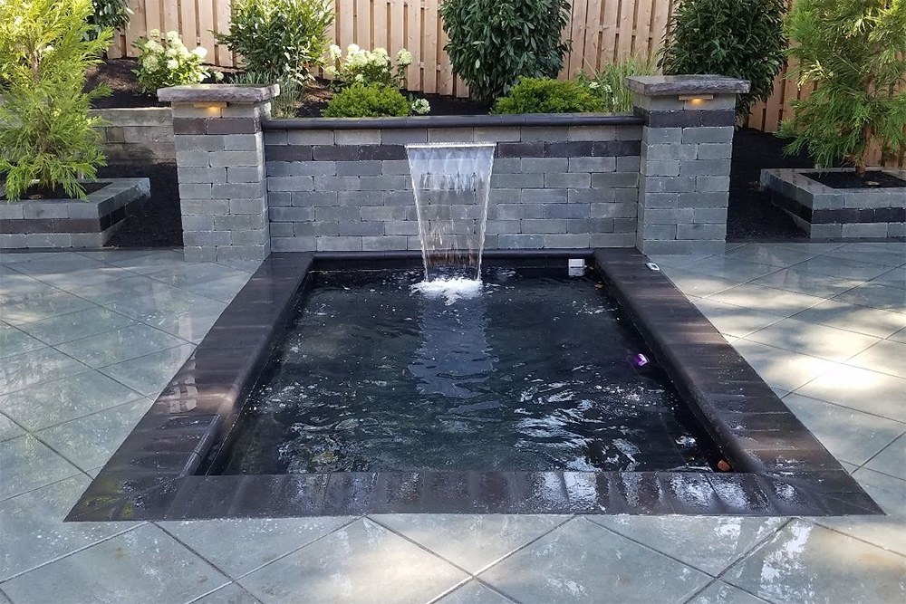 Immerspa Eternity inground spa with a waterfall feature