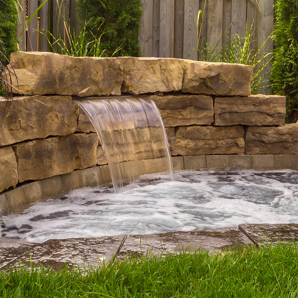 Immerspa inground spa with a waterfall feature