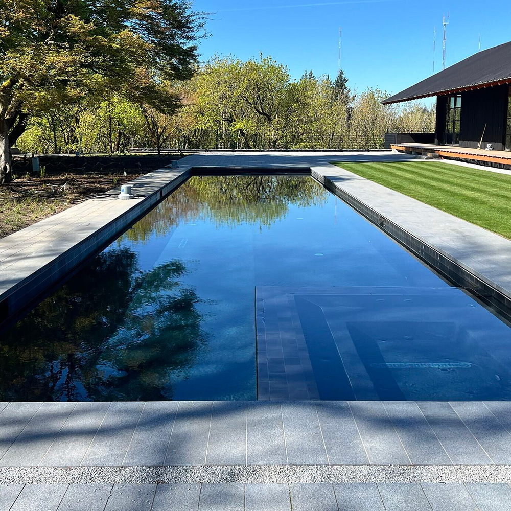 a custom inground pool with inset spa from Water's Edge Pools & Spas
